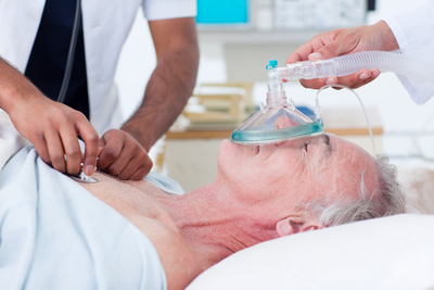 Doctors resuscitating a senior patient